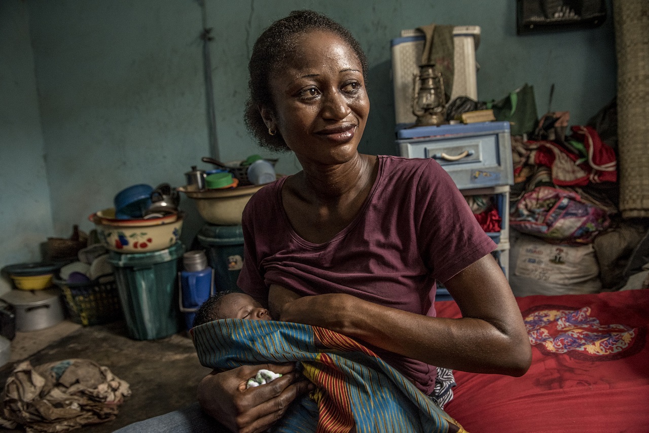 nwafor monica breastfeeds her newborn at home.