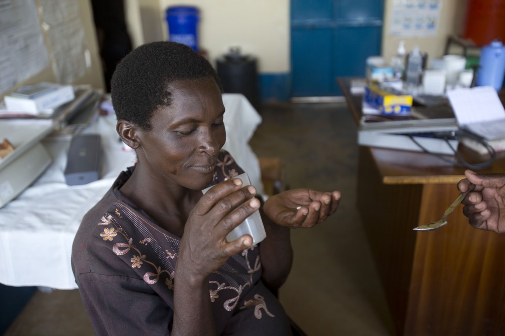 A pregnant woman receives malaria prevention medicine at a clinic in western Kenya
