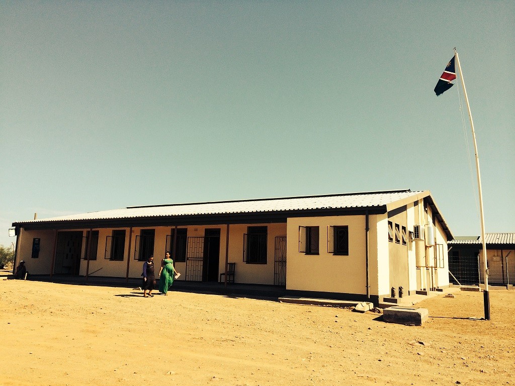 Two women walking outside a rural health facility in Namibia