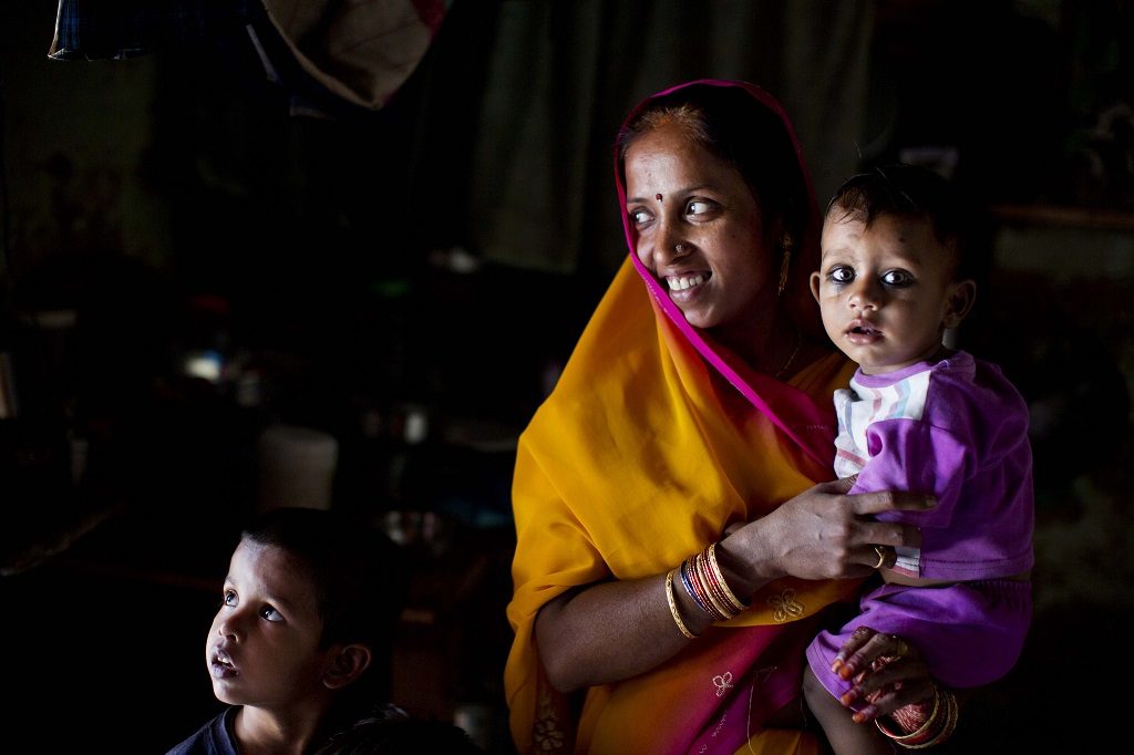 A woman with her children in Allahabad, India