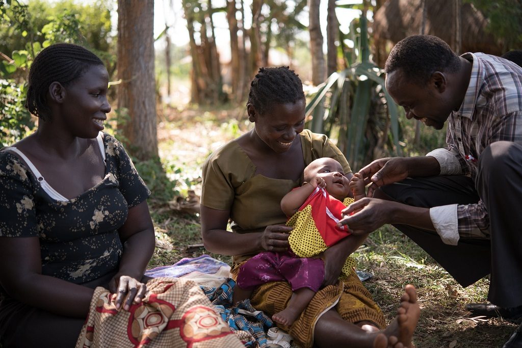 Mothers and a community health worker at a breastfeeding support group in Migori, Kenya.