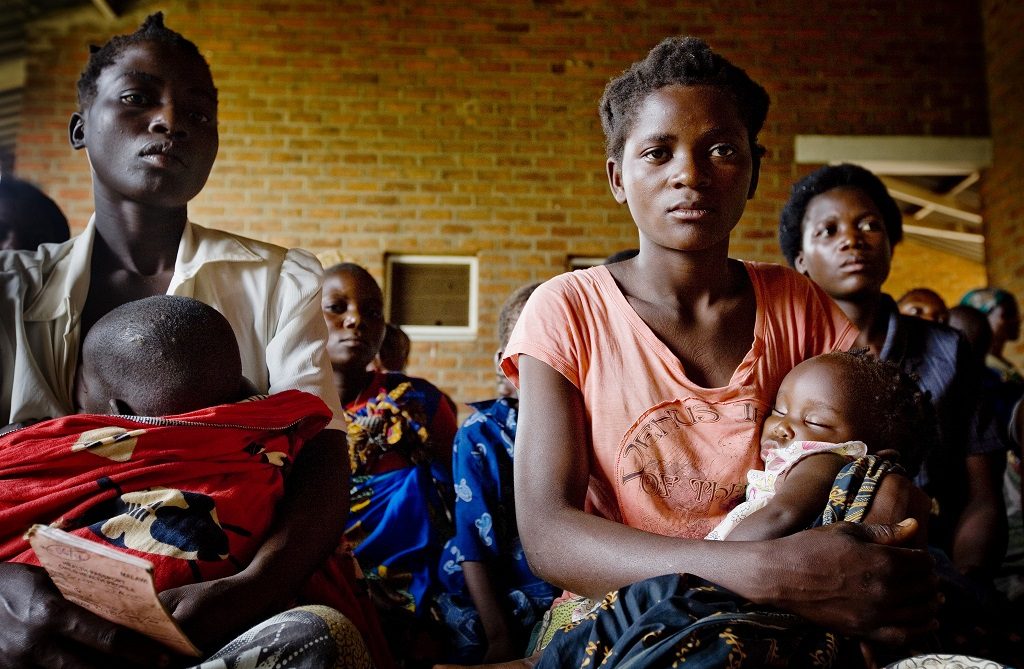 Mothers and children waiting to see a doctor in the village of Kaniche, in the district of Tamwanza, Tanzania