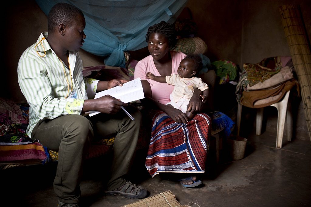 A mother of four is visited by a community health volunteer in her home near Maputo, Mozambique.