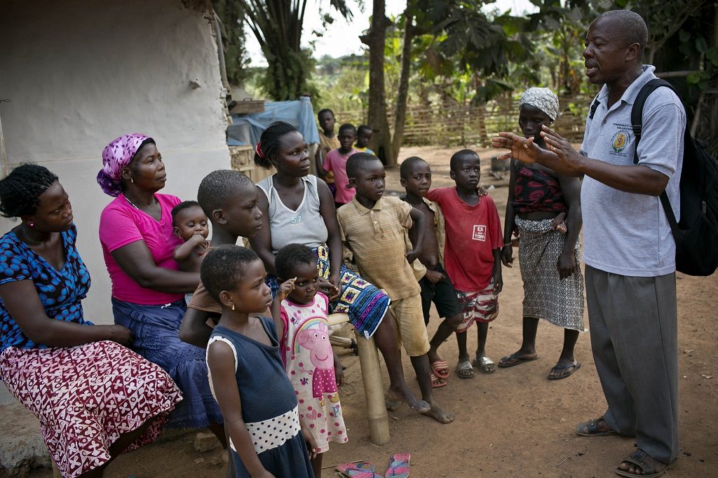 community health volunteer in Ghana promotes health messages