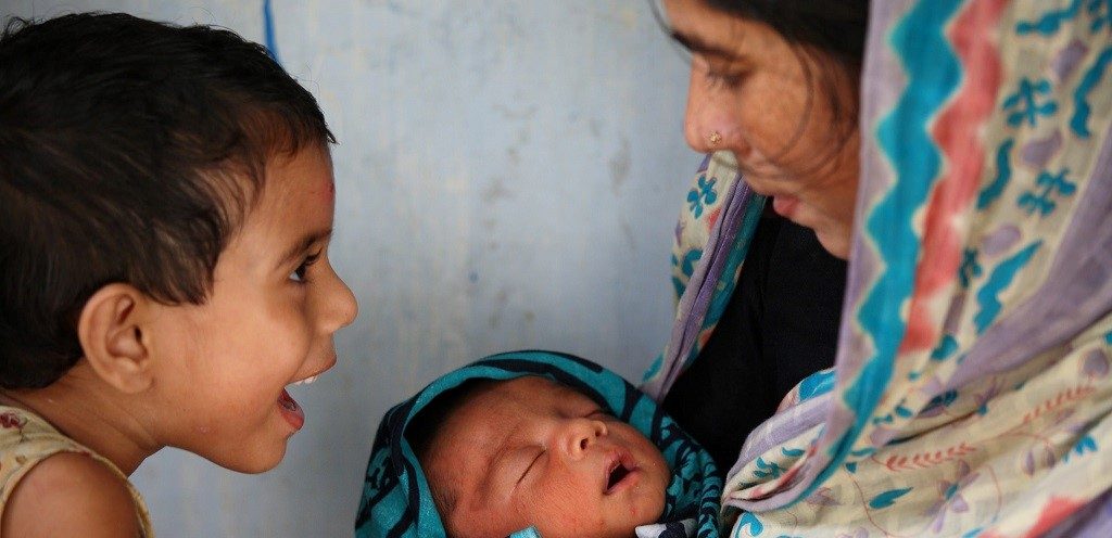 Above: A newborn baby with mother and sibling in Bangladesh.