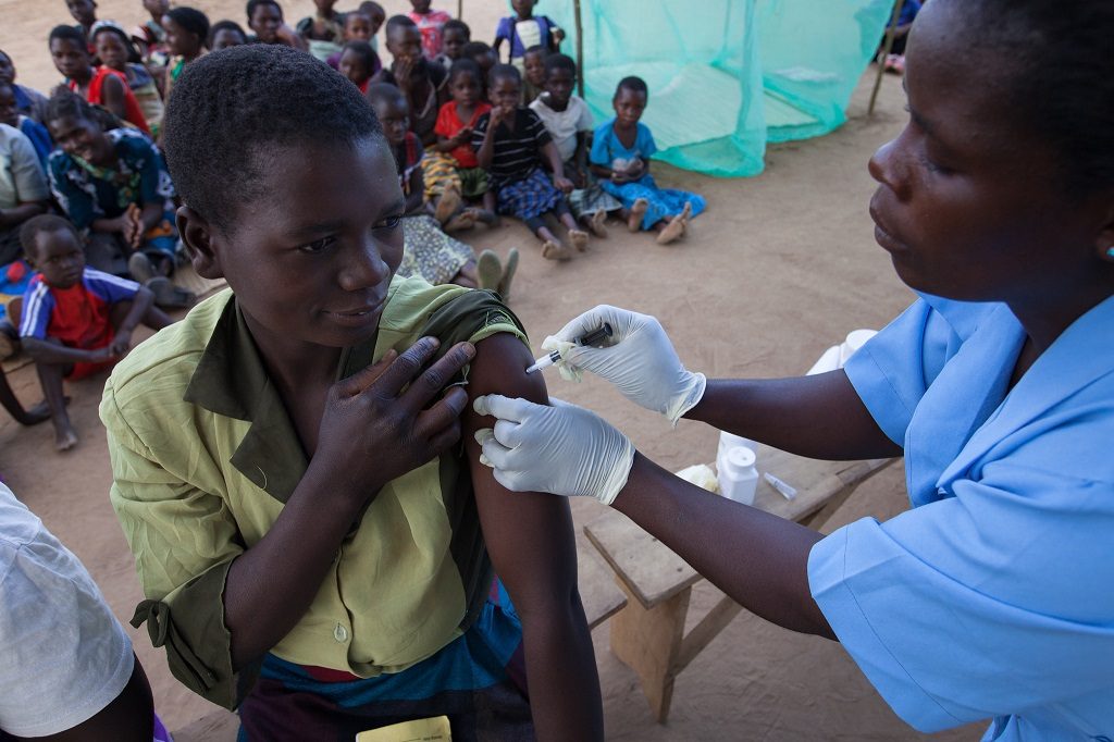 Woman in Malawi receives an immunization