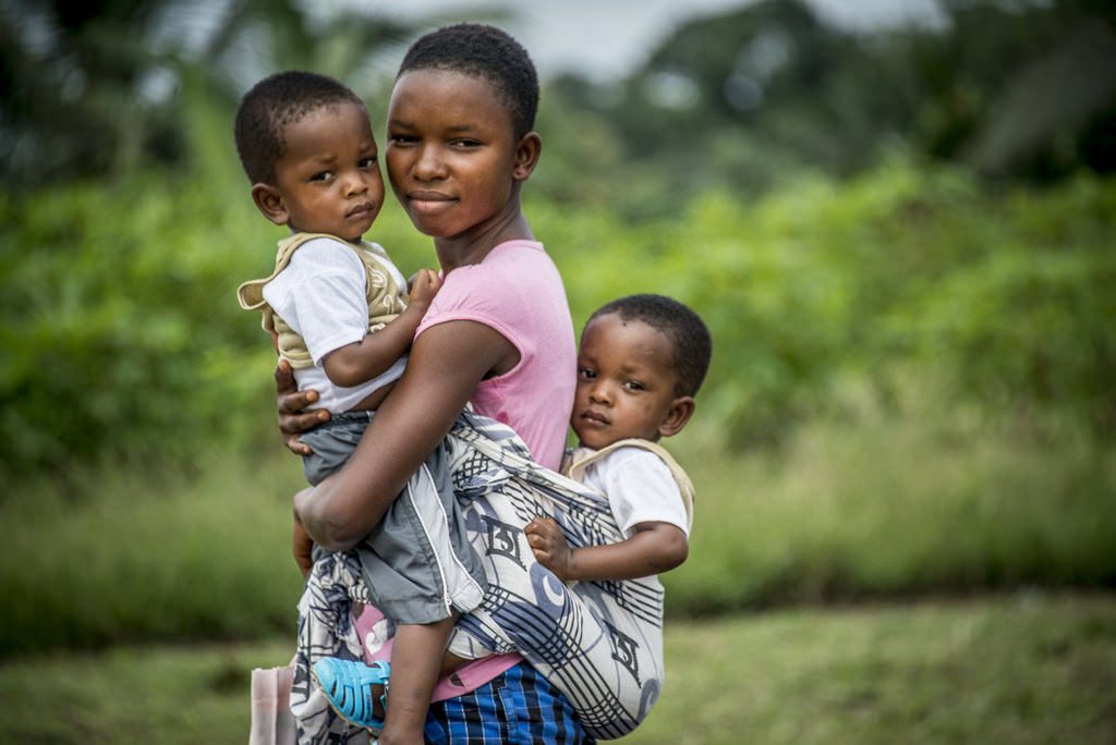 A mother with her children in Ghana.
