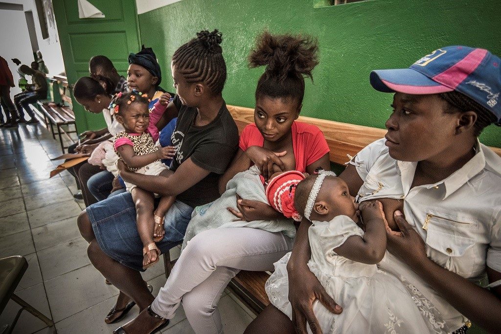 Women with children waiting for care in Marmalade, Haiti.