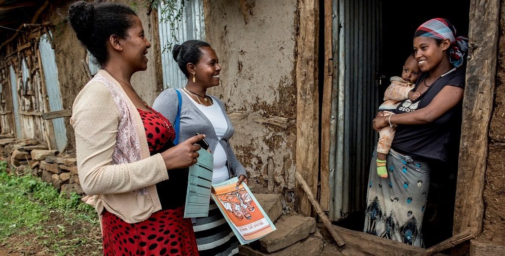 Health Extension Worker Misaye Asmamaw visits Addise Yaregale and her son, Saleamelak,at home.