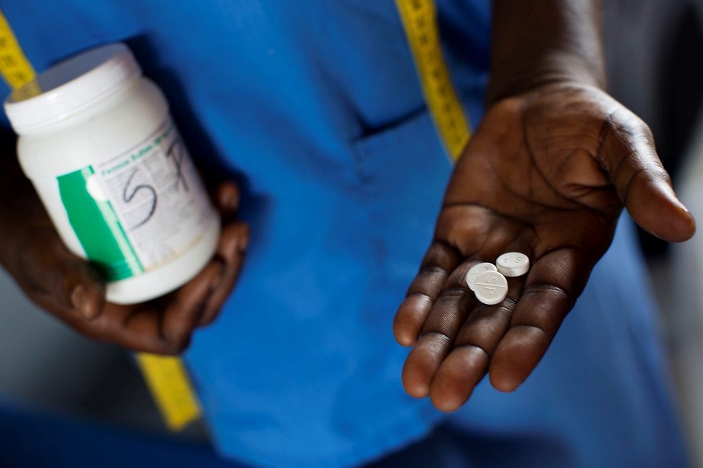 A health worker administers malaria prophylaxis drugs to pregnant women at a facility in DR Congo.