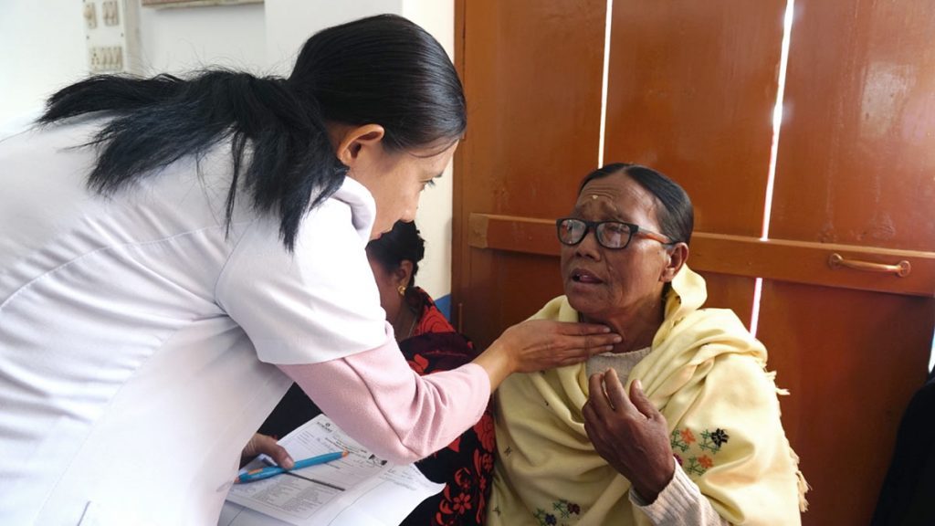 Nurse Maibam Ranita Devi examines a patient