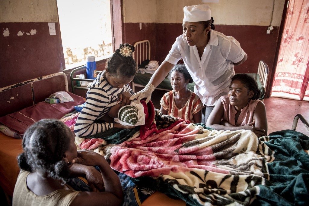 Midwife Haingomalala Roilande Richter checks on mothers in a maternal ward in Madagascar.